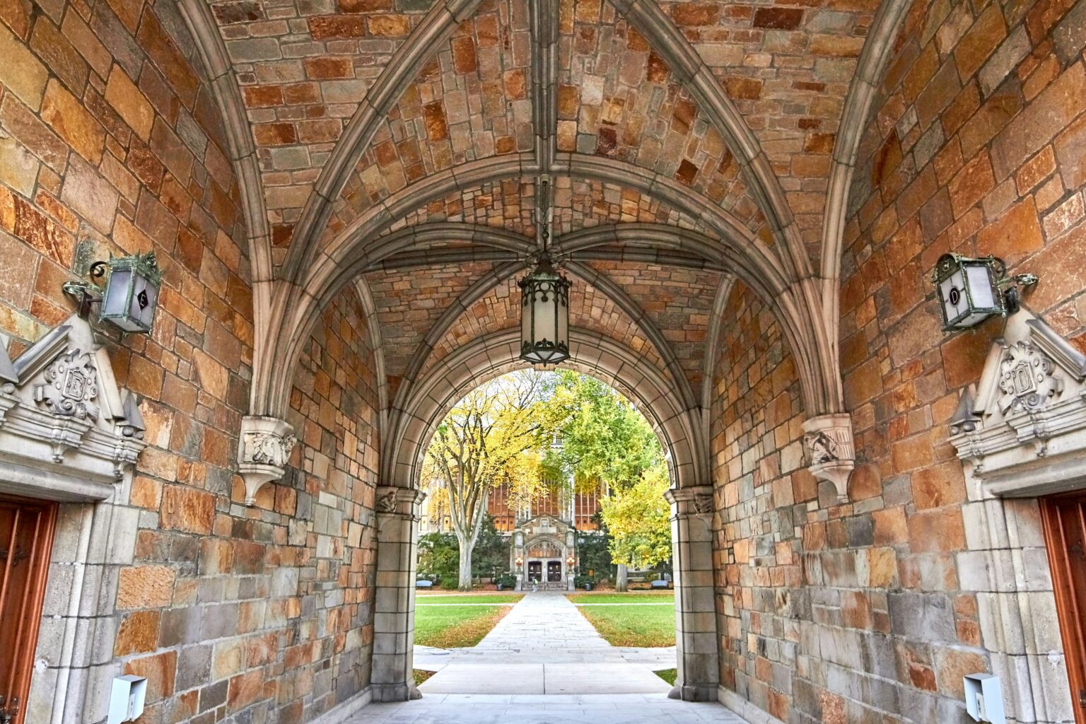 Historic stone archway at University of Michigan Ann Arbor campus in autumn