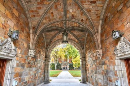 Historic stone archway at University of Michigan Ann Arbor campus in autumn