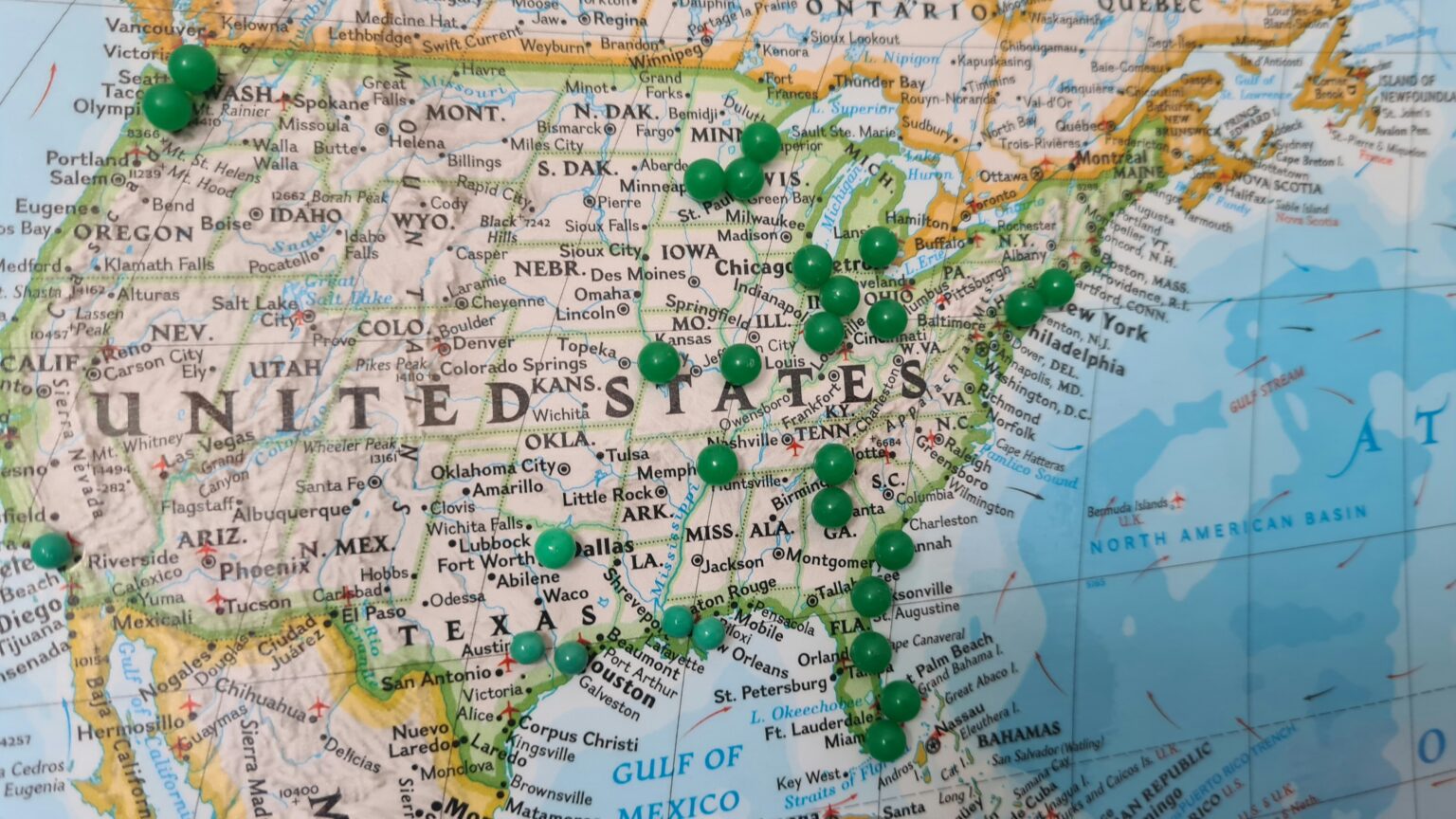 United States map with green pins marking affordable cities and cheapest places to live