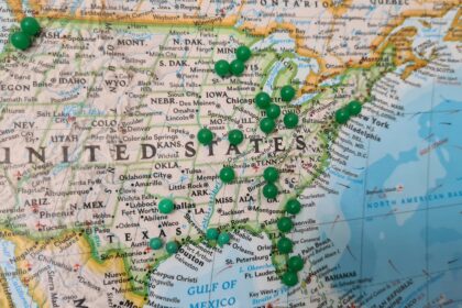 United States map with green pins marking affordable cities and cheapest places to live
