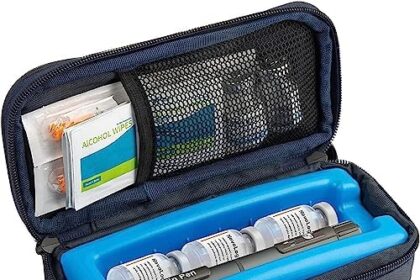 An open insulin travel cooler case with a blue gel pack tray holding insulin pens and alcohol wipes