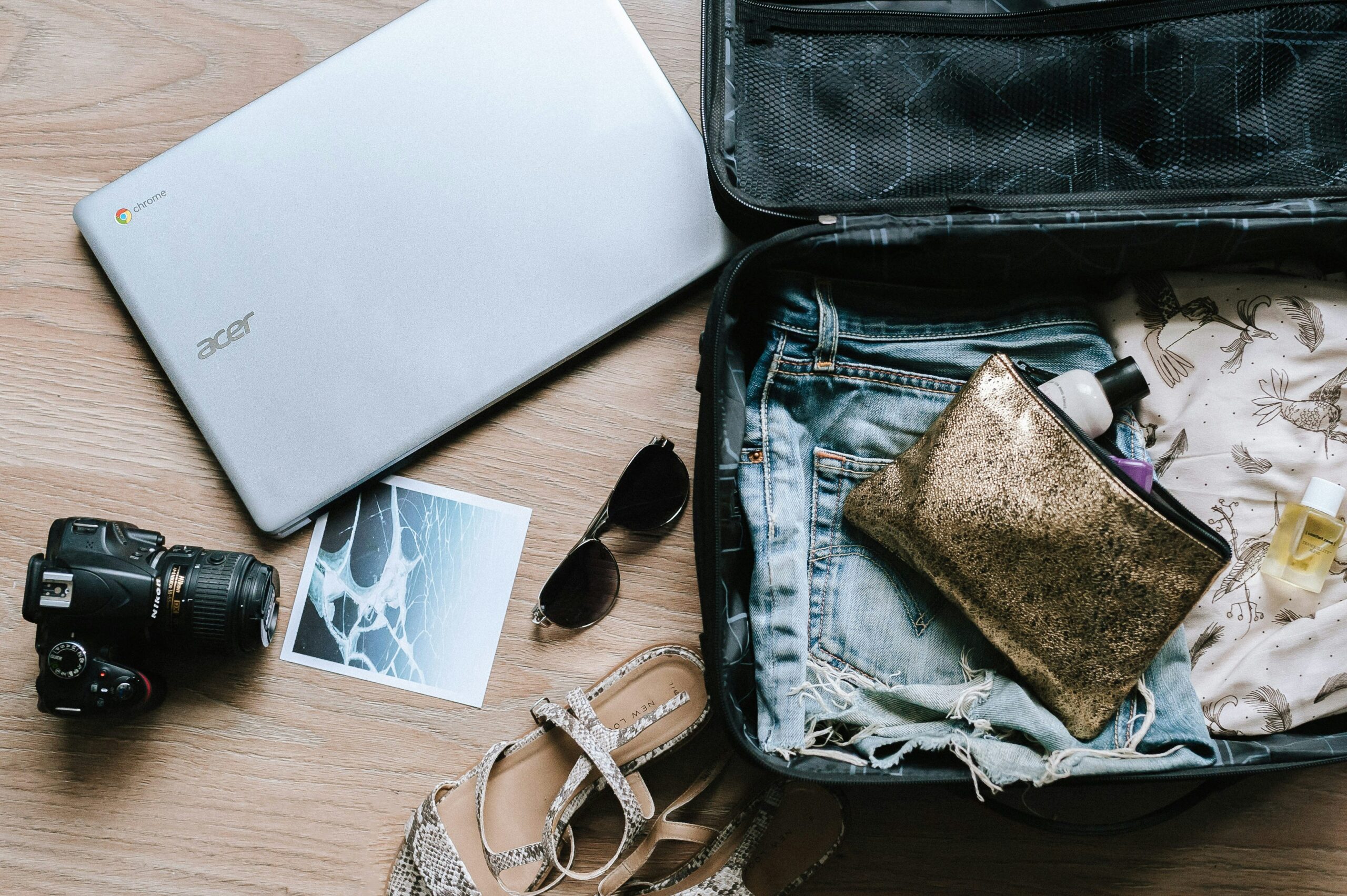 Printed photos and travel documents arranged for a travel album