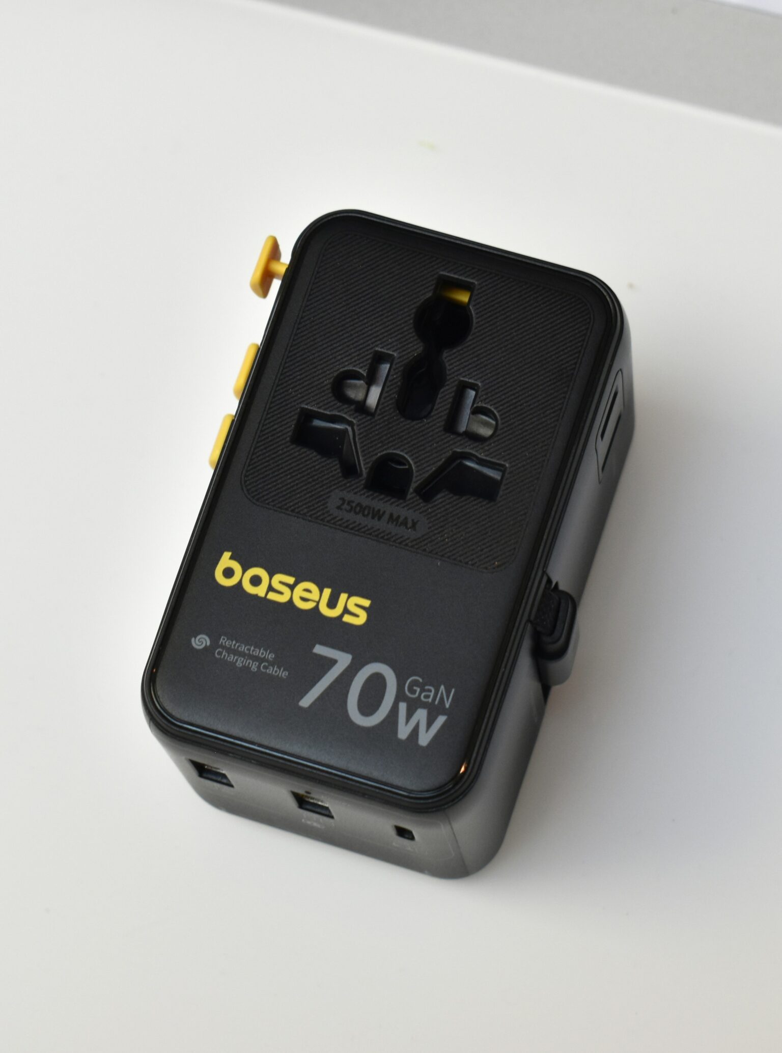 Universal travel adapter with multiple plug slots and USB ports