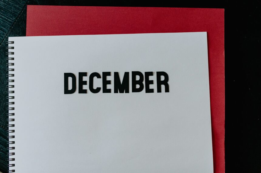 Best places to travel in December shown by the word December in bold letters on a notebook