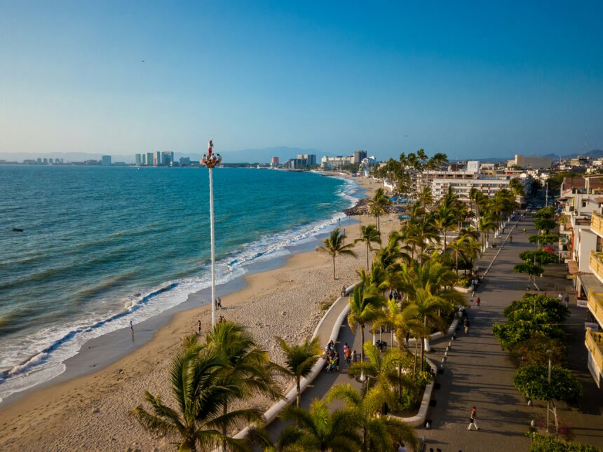 Coastal city beach view with palm trees and ocean for Costa Careyes Mexico.