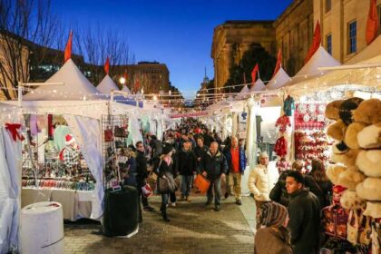 DowntownDC Holiday Market at Penn Quarter with crowds at dusk